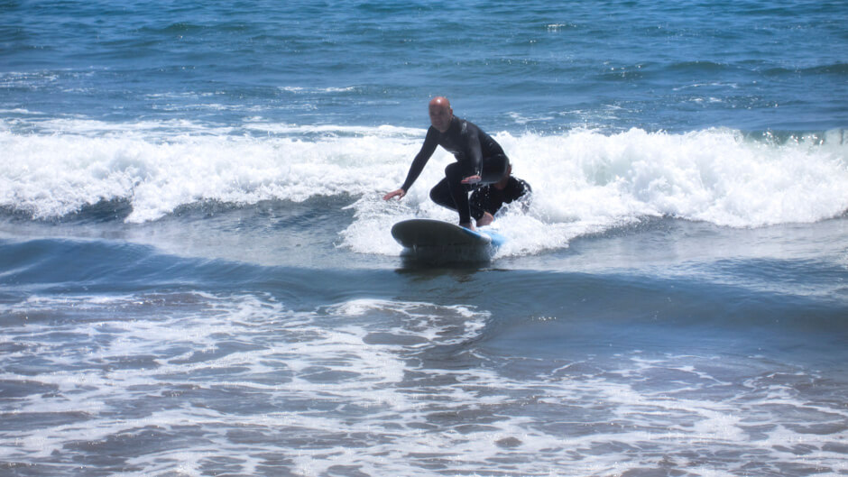 Me getting up on the board on my first try - all credit goes to Rob, our instructor!